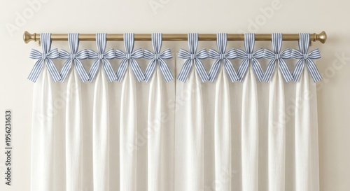 White curtains with blue and white striped bows on a gold rod, ideal for nursery or home deco