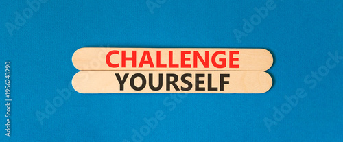 Challenge yourself words symbol. Concept words Challenge yourself on beautiful wooden sticks. Beautiful blue background. Business lifestyle and Challenge yourself words concept. Copy space.