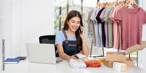Young Asia businesswomen using mobile phone call receiving purchase order and check product on stock work at home office. Small business owner, online market delivery freelance concept.