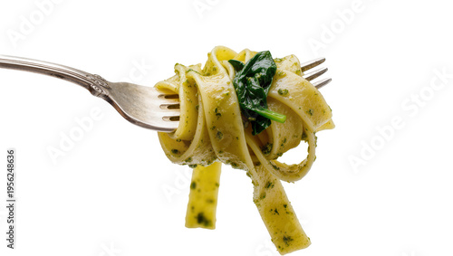 Canvas Print Isolated fresh tagliatelle pasta with green pesto and spinach twisted around a m