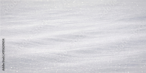 A pristine snowy landscape that evokes a sense of cold, serene quiet beauty. This image creates an inviting minimalist background, perfect for a wide variety of designs.