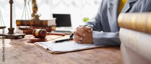 Fotografie Lawyers Consultation and conference discussing legal matters at a desk with a gavel, scales of justice law symbolizing law and justice, justice and lawyer Business partnership meeting concept