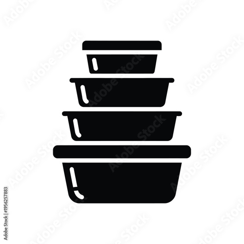 Stack of four black rectangular food containers in ascending order of size for food storage and organization