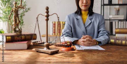 Lawyers Consultation and conference discussing legal matters at a desk with a gavel, scales of justice law symbolizing law and justice, justice and lawyer Business partnership meeting concept.