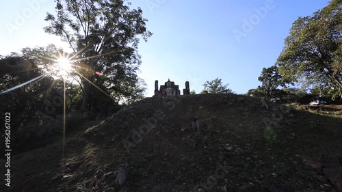 The video's natural background depicts the atmosphere of the ancient Sukhothai Historical Park, an educational site featuring ancient Buddha statues and pagodas.
