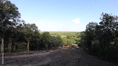 The video's natural background depicts the atmosphere of the ancient Sukhothai Historical Park, an educational site featuring ancient Buddha statues and pagodas.