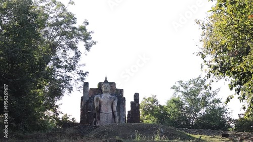 The video's natural background depicts the atmosphere of the ancient Sukhothai Historical Park, an educational site featuring ancient Buddha statues and pagodas.