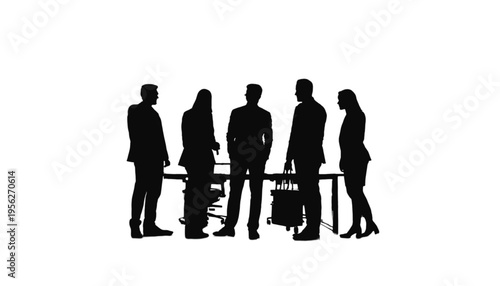 Five colleagues stand around a large table in silhouette discussing important strategy during a serious.