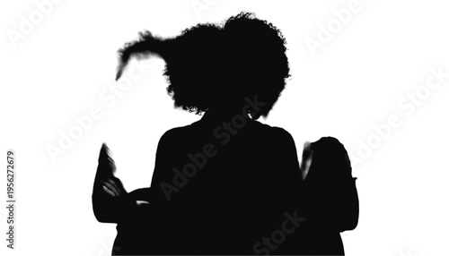 Silhouette of a woman with voluminous hair sitting down against a bright white background.