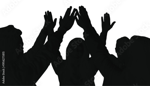 Group of diverse people celebrating success with hands raised together in a unified high-five gesture.