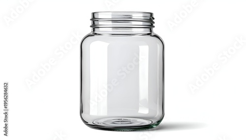 A simple, transparent glass jar with a metallic screw-on lid stands against a stark white backdrop, casting a subtle shadow