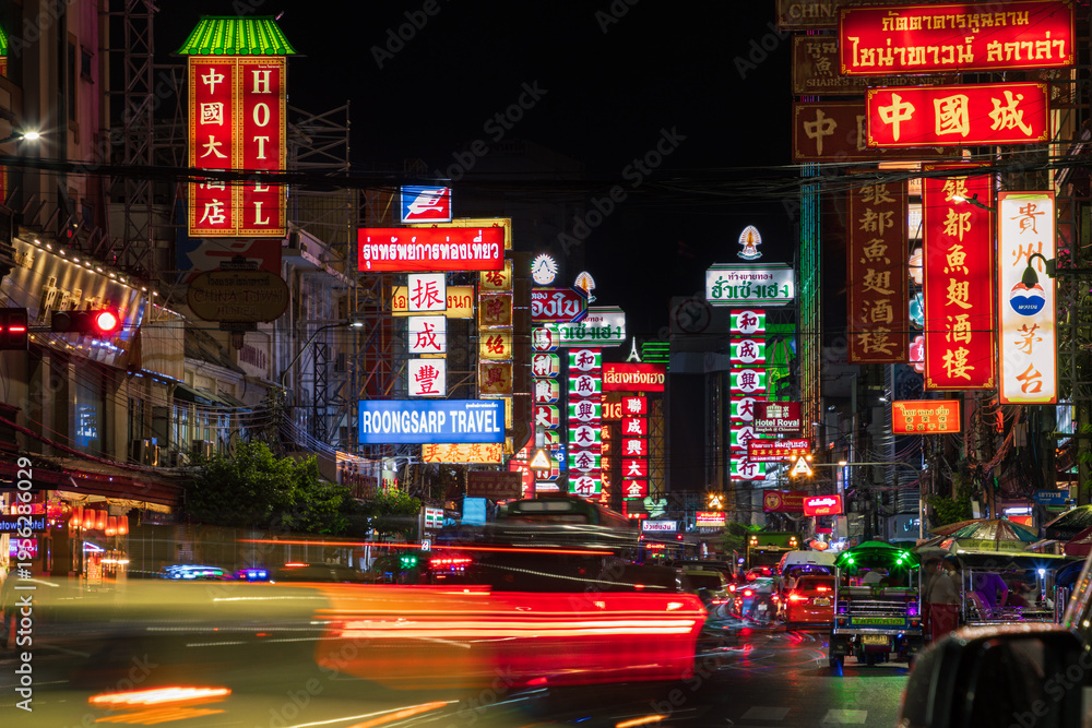 Fototapeta premium Stunning light trails of traffic at night in Yaowarat Road, Chinatown, Bangkok, Thailand