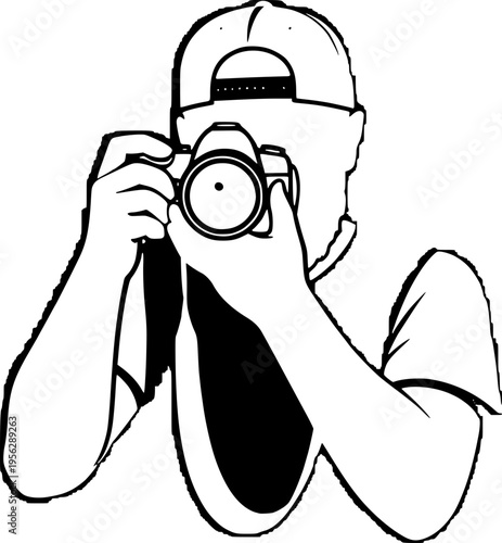 Man wearing a cap taking a photo with a digital camera