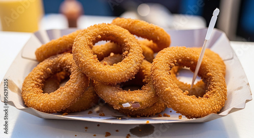 Wallpaper Mural Crispy Golden Onion Rings in a Paper Tray with a Toothpick, Ready to Eat as a Snack Torontodigital.ca
