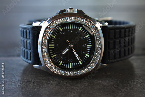 Luxury watches placed on a glittering glass floor