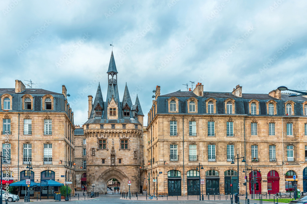 Fototapeta premium Bordeaux city with Porte Cailhau historic medieval gate and surrounding classical architecture, Gironde, Nouvelle-Aquitaine, France. French old town buildings. Travel and touristic landmark in Europe