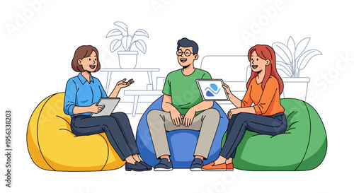 Colleagues Collaborating on Tablet in Modern Lounge