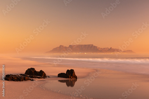 scenic view of table mountain from bloubergstrand at sunset in cape town south africa