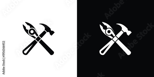 Black and white crossed hammer and wrench tools