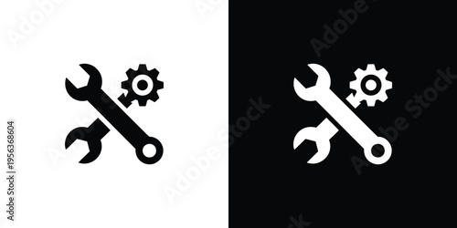 Black and white wrench and gear on split background
