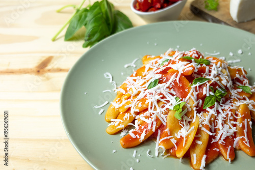Italian pasta with tomato sauce and grated cheese, homemade meal and comfort food concept