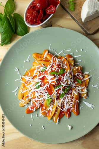 Italian pasta with tomato sauce and grated cheese, homemade meal and comfort food concept