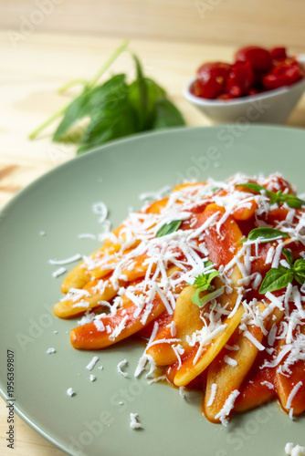Italian pasta with tomato sauce and grated cheese, homemade meal and comfort food concept
