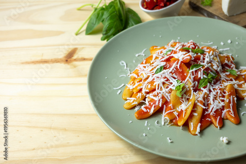 Italian pasta with tomato sauce, cheese and fresh ingredients, home cooking and food marketing concept