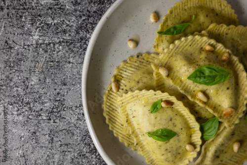 Close up of Italian ravioli with pesto sauce, traditional cuisine and food photography concept