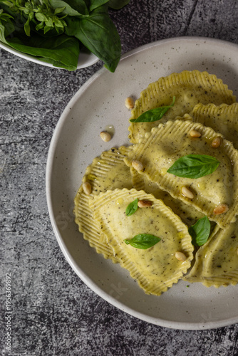 Close up of Italian ravioli with pesto sauce, traditional cuisine and food photography concept