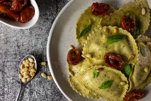 Italian ravioli with pesto, basil and pine nuts, traditional recipe and food marketing concept