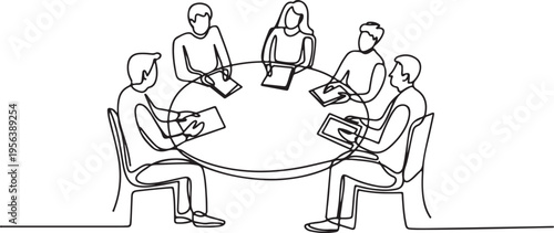 Five people in a meeting around a round table discussion