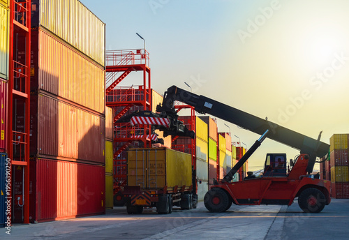 Reach Stacker Loading Shipping Container onto Semi Truck Trailer