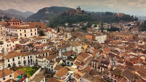 Wallpaper Mural Aerial view of the historic Albaicin district in Granada, white houses and narrow streets with Alhambra in background. Old moorish quarter of Albaicin in Granda, Spain Torontodigital.ca