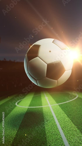 Soccer ball flying over green football pitch.