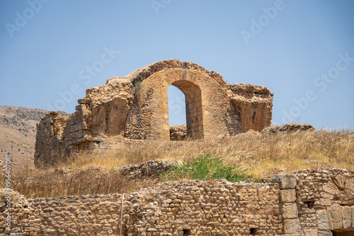 Arched opening in a wall, in the ruins of a Roman villa in Bulla Regia, outside of Jendouba, Tunisia