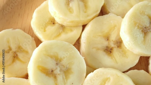close-up captures the creamy allure of sliced bananas. Each uniform piece unveils a soft	