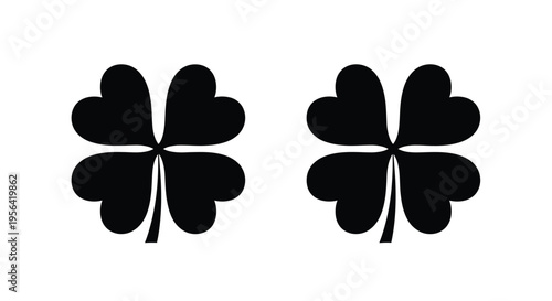 Two black silhouettes of four leaf clovers against a white background