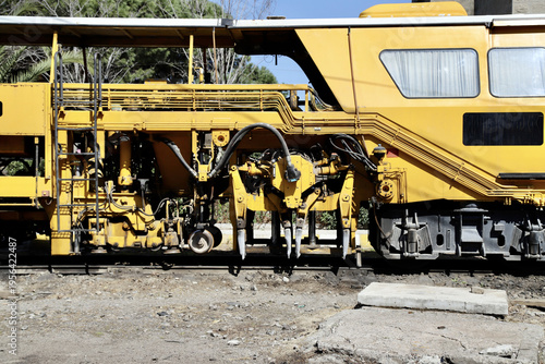 Yellow Ballast Tamper for Railway Maintenance, Industrial Railway Maintenance Equipment Close-Up