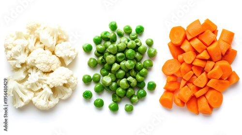 A plate of fresh vegetables including cauliflower, peas, and carrots on transparent background