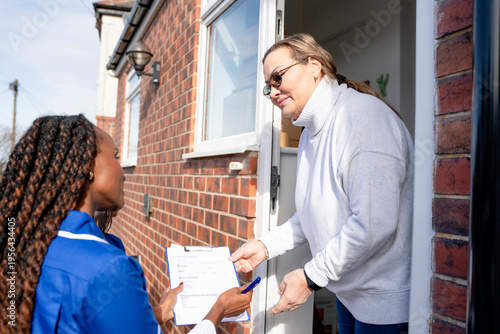 Nurse visits home to provide care and support for patient in suburban neighborhood at home