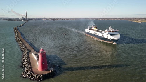 The ship leaving Dublin port with a view Poolbeg Lighthouse