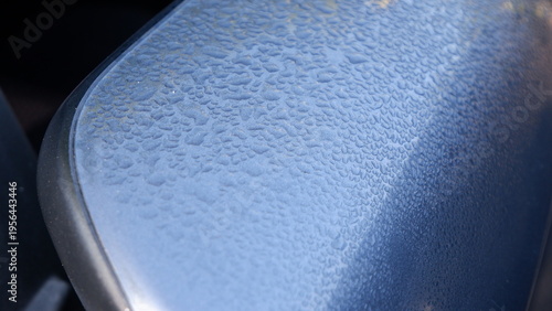 Photography Close-up view on Morning Dew Drops on Car Side Mirror Surface