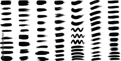 Collection of various black brush strokes and marks on white background