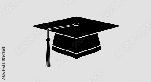 A simple black graduation cap icon on gray background