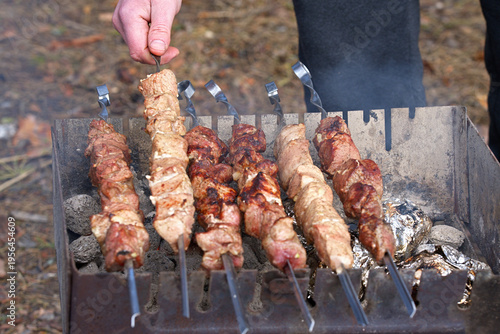Tableau sur toile The process of cooking shashlik on a grill