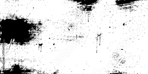 Abstract grunge background featuring a black ink splat with paint splatters and dirty liquid spray textures in a vector illustration design element
