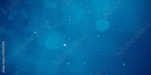 Blue raindrops on window with winter holiday lights and snowflake patterns