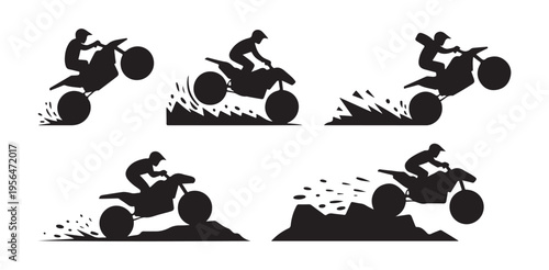 Motocross dirt bike rider performing stunts with spray and splashes on terrain background