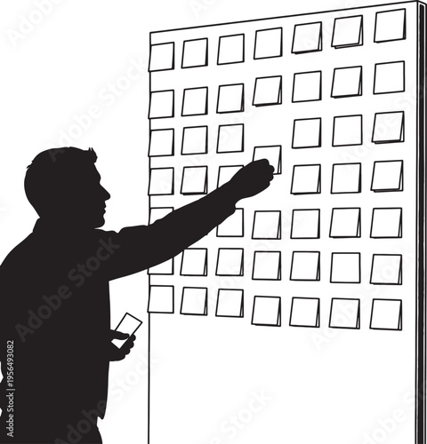 Man Placing Sticky Notes on Whiteboard